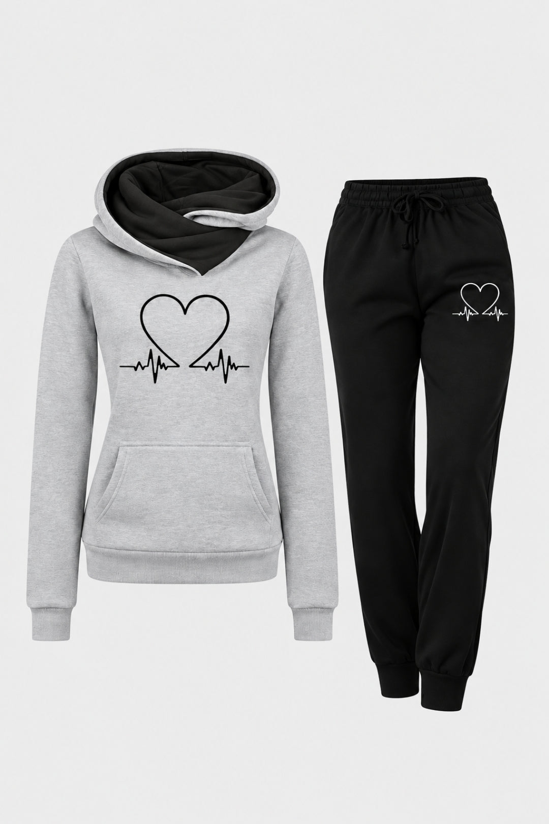 Ljusgrå damhoodie med svart foder i huvan och hjärtslagsmönster, i kombination med svarta joggingbyxor